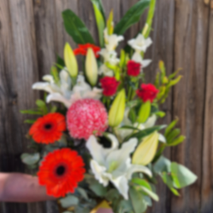Valentine's Day- "Florists choice" Bright medium box arrangement to include 3 red roses